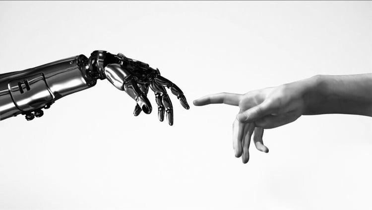 AIと人の協働 ─ 手を伸ばすロボットアームと人の手